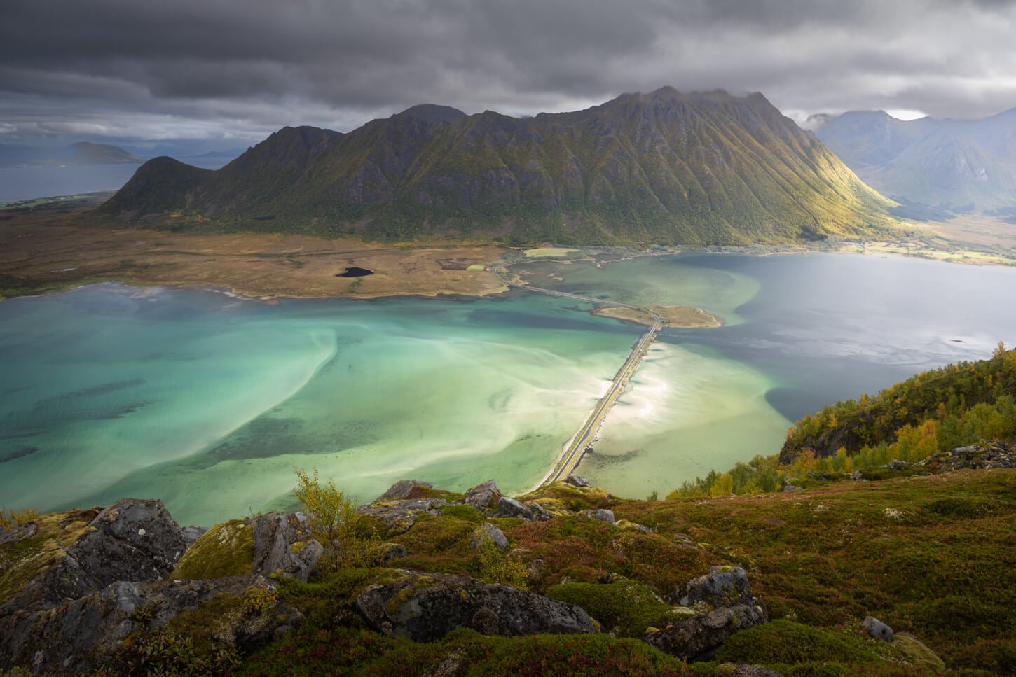 Panoramic views of the blue water and sandy banks of Grunnførfjorden on the Hike to Marmora, from Delpsheia's summit