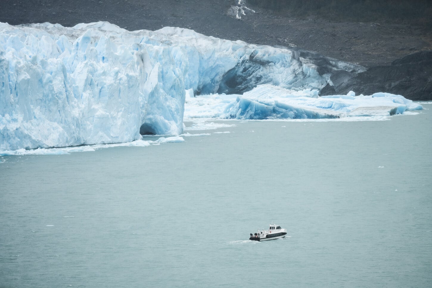 Boat passing by Perito Moreno's glacier front