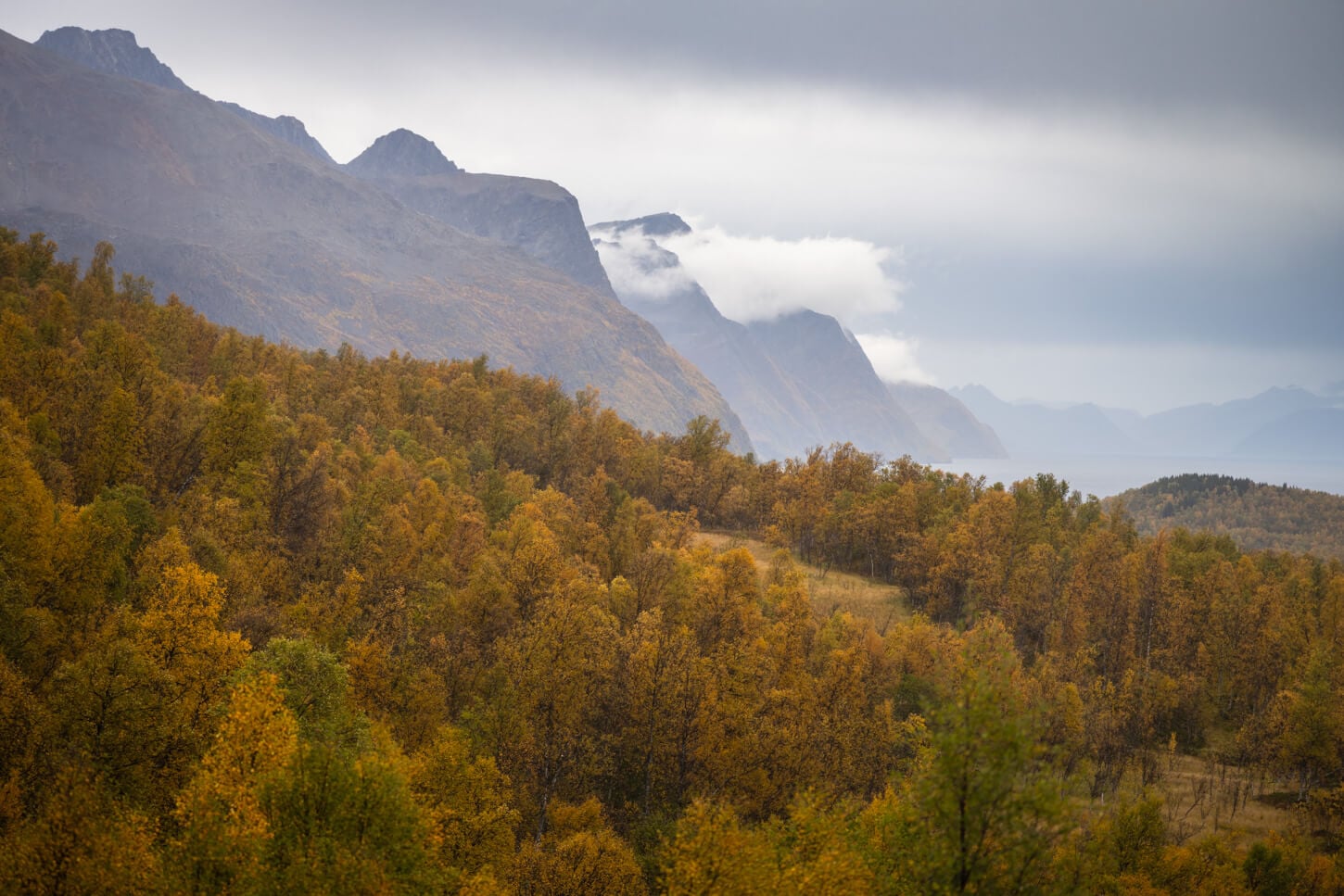 East side of the Lyngen alps in autumn with multiple layers of mountains vanishing in the distance