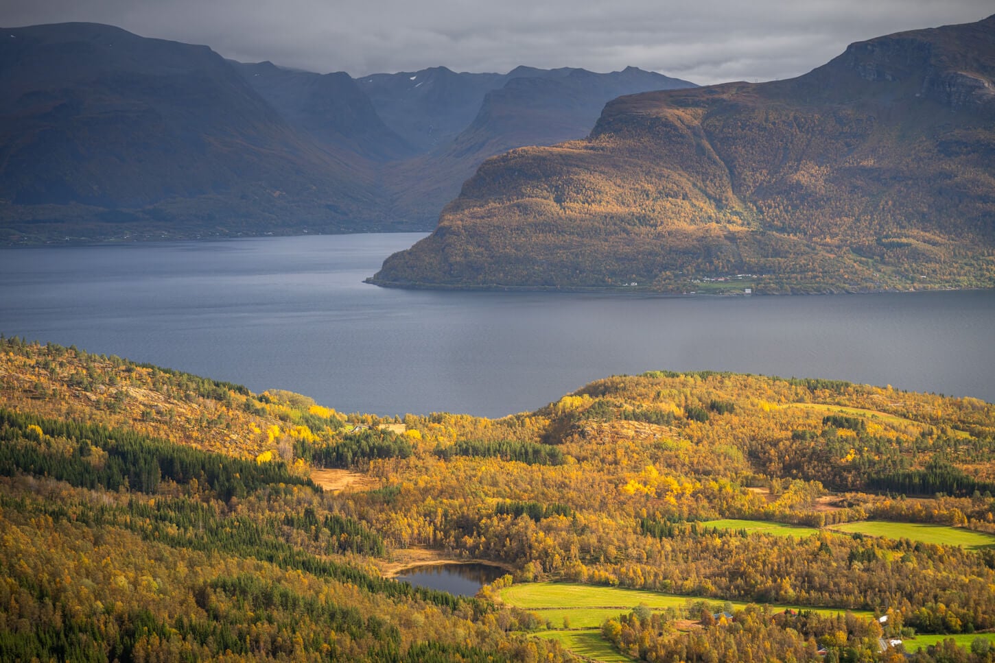 Derail of the landscape with rolling hills and mountains around Lyngenfjord.